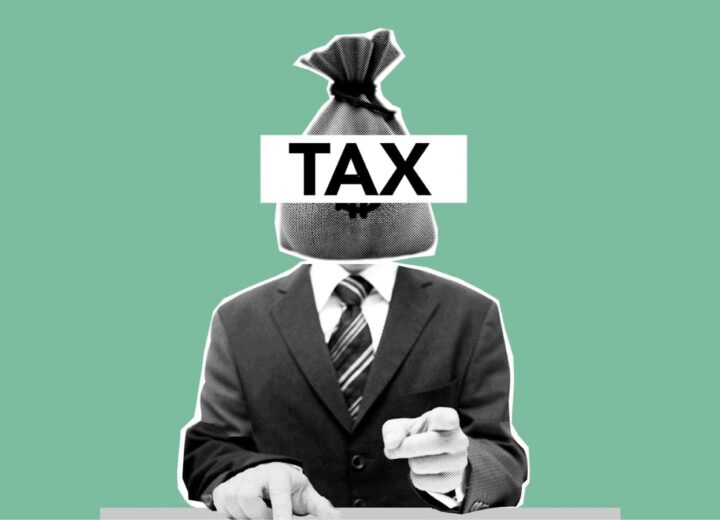 Creative composition of a businessman with a tax bag head on a green background, symbolizing finance.