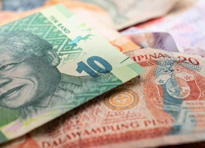 A detailed image featuring South African rand and Philippine pesos, highlighting cultural diversity in currency.